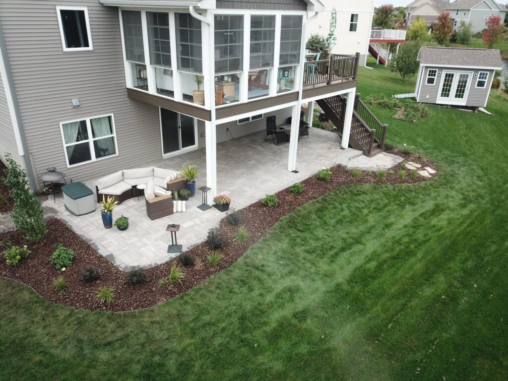 back yard paver patio with walkway landscape rock and shrubs in Apple Valley MN