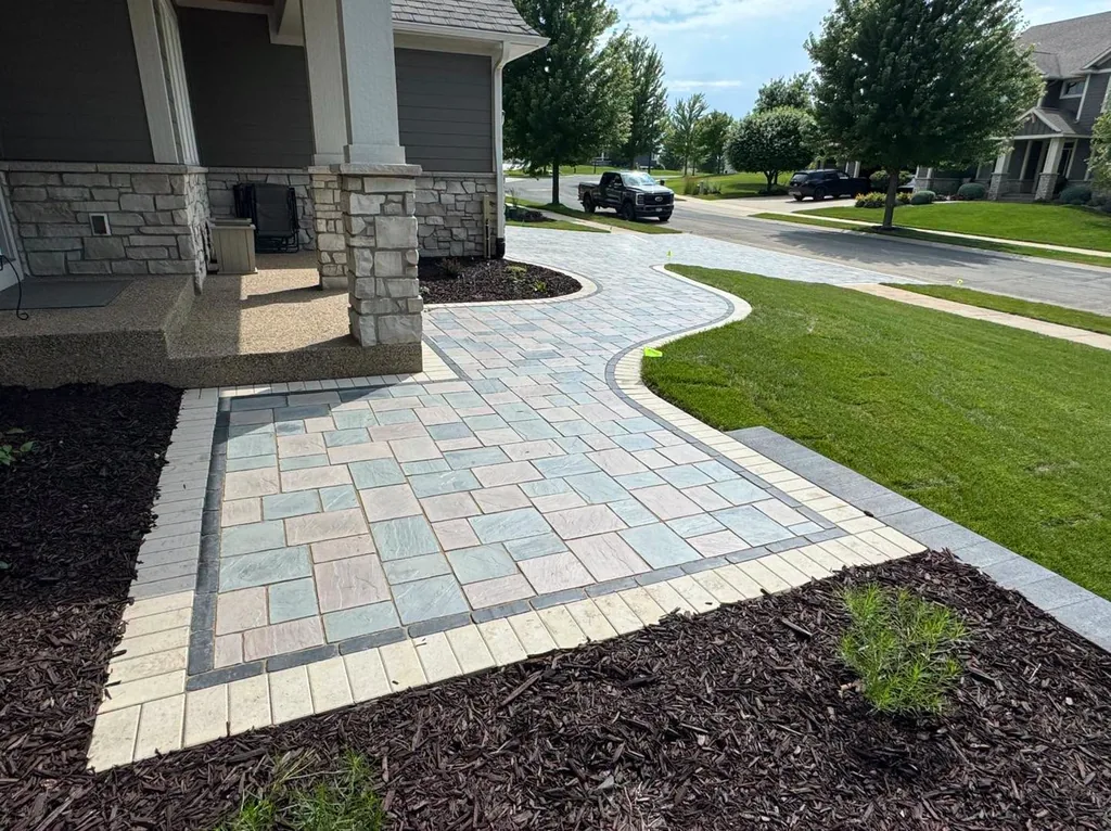 Curved paver walkway leading to a home's front entry